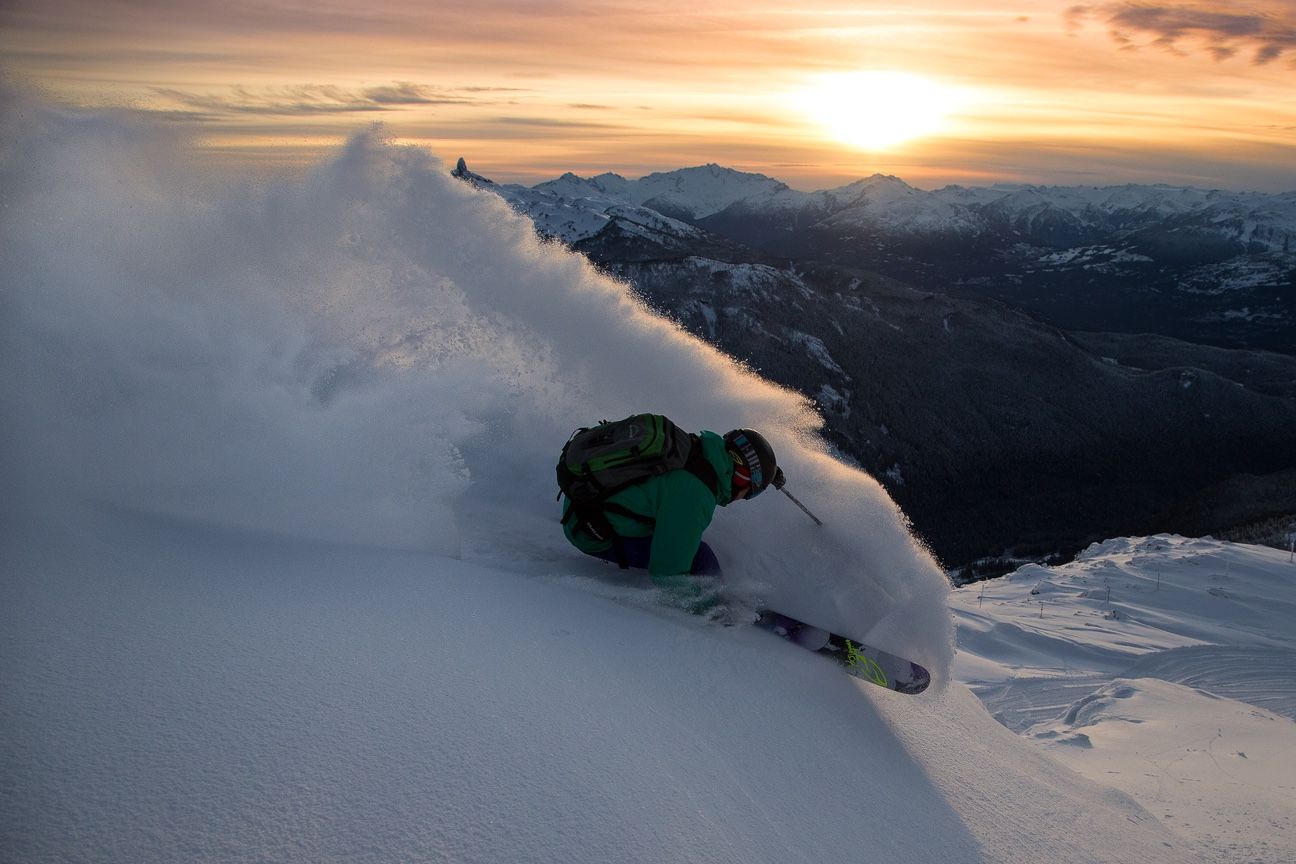 powder skiing sunset