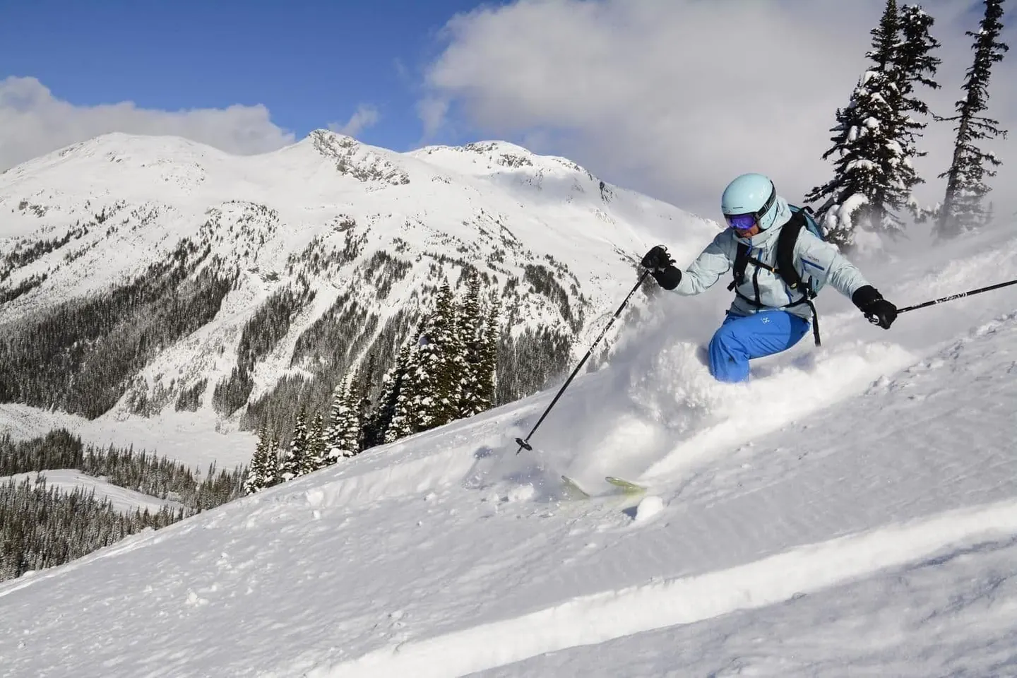 Female skier in powder on an off piste ski course in Whistler Blackcomb