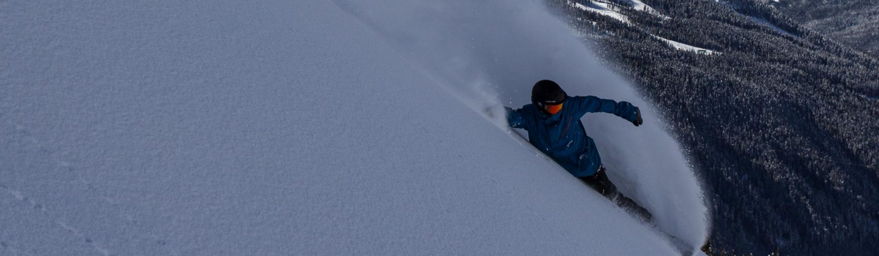 Off-piste-snowboarding-photo-of-skier-on-steep-powder-slope