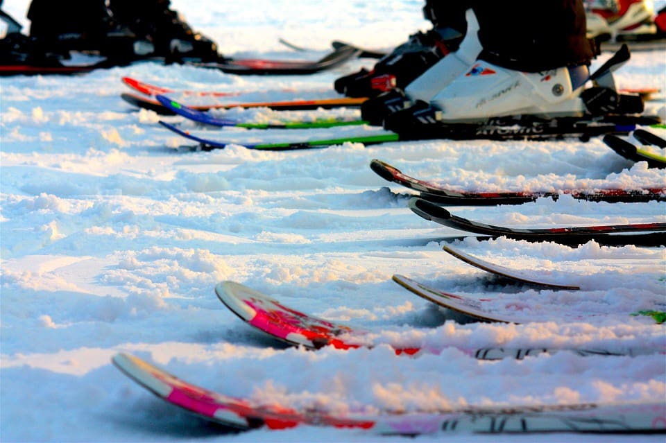 skis lined up and ready to go at alltracks