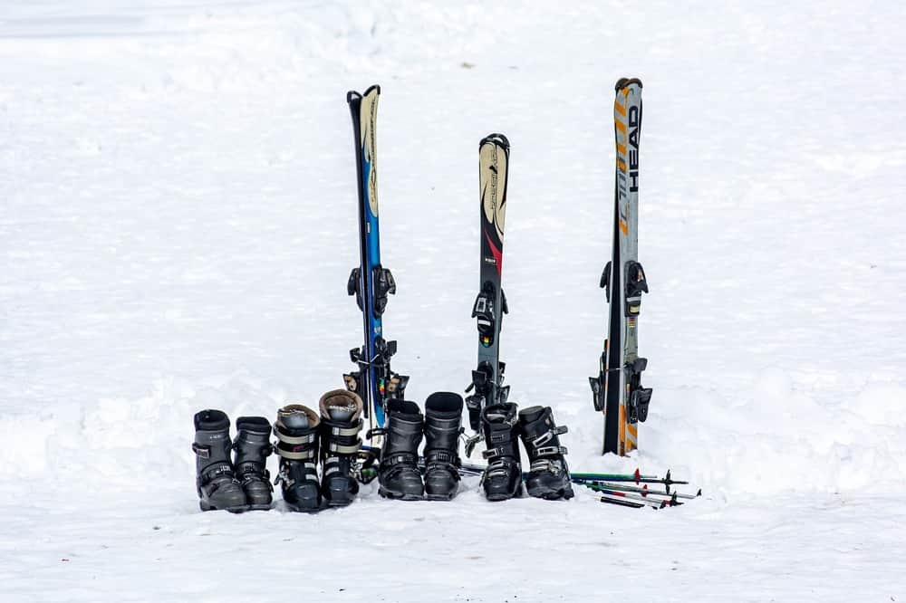 ski boots and poles in snow
